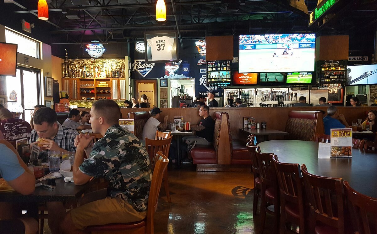 Burgers and Beer dining room with multiple televisions showing sports programming