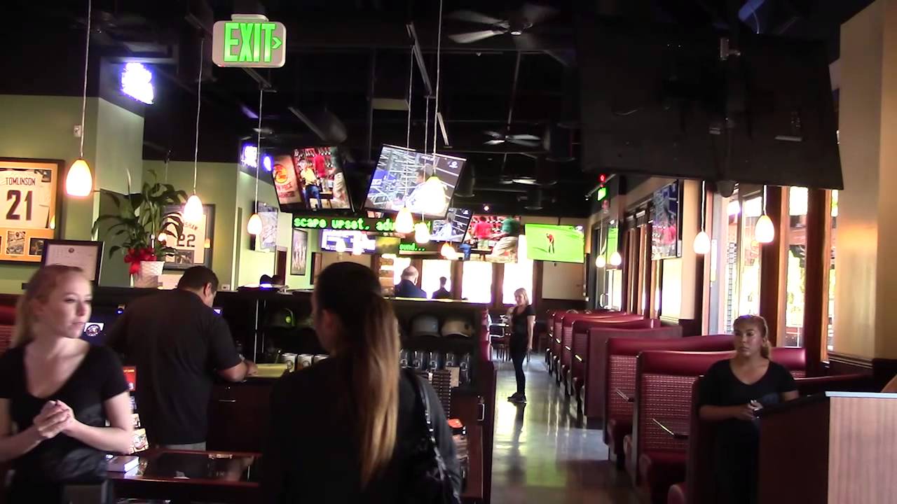 Burgers and Beer restaurant interior with multiple televisions along the dining area