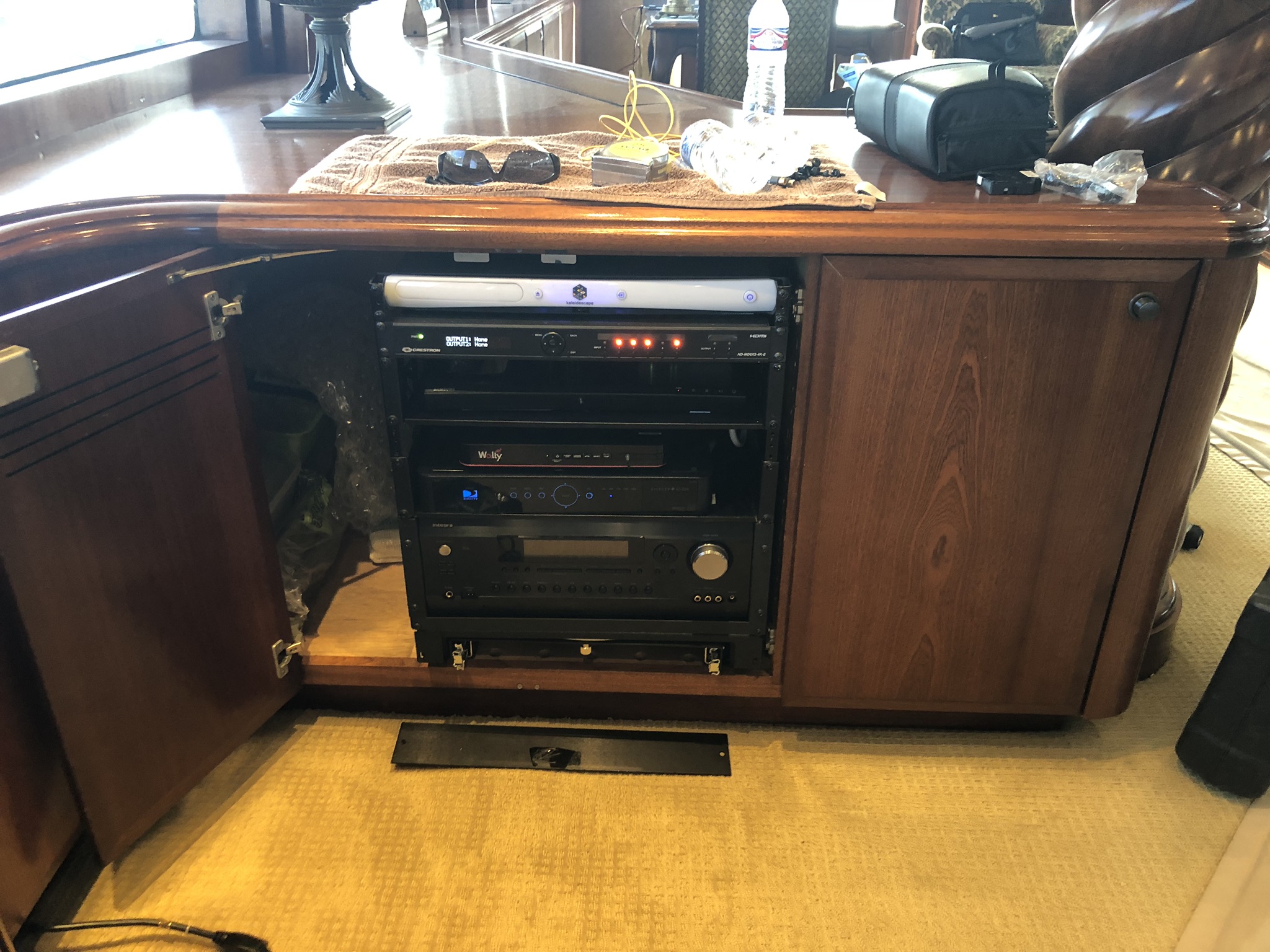 Custom yacht AV equipment rack integrated into cabinetry